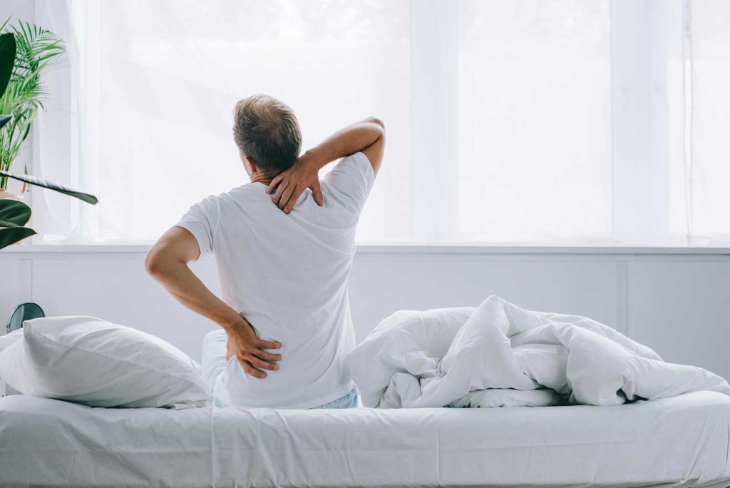 Man Waking Up Living With Spondylolisthesis