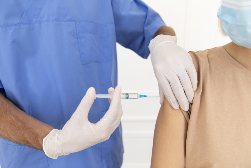 close up person getting vacciated